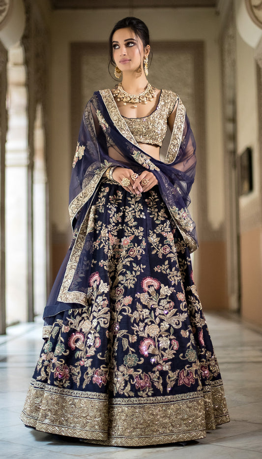 Guldaan Lehenga: Dark Blue Raw Silk with Floral Clusters & Zardosi Border